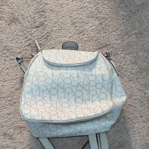 Calvin Klein Handbags - Calvin Klein Monogram Cream Backpack